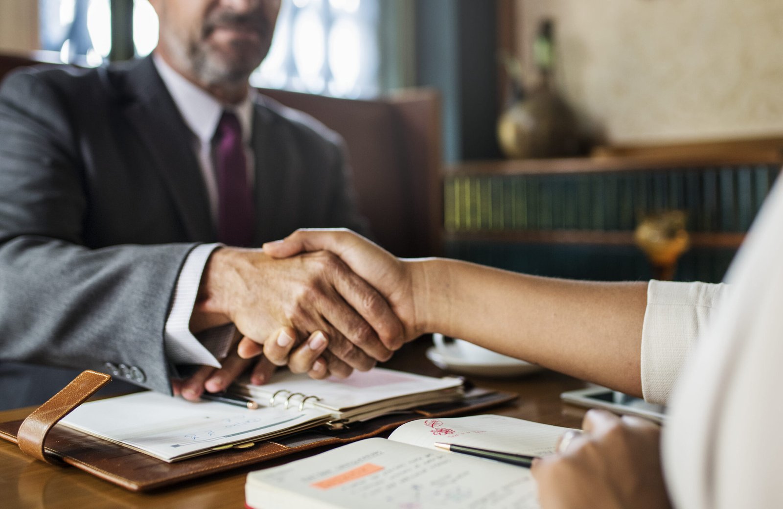 man making deal with another man