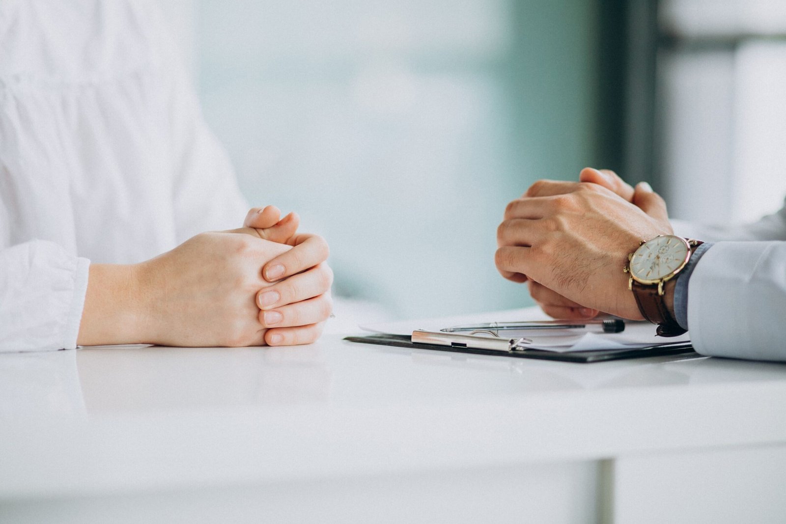 physician consulting his patient clinic