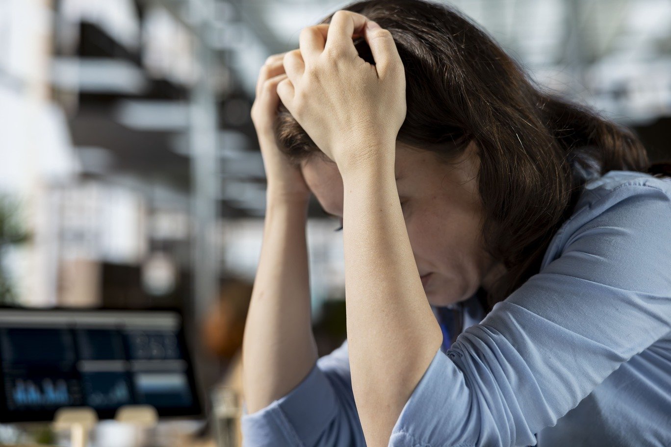 young employee deals with emotional strain frustration
