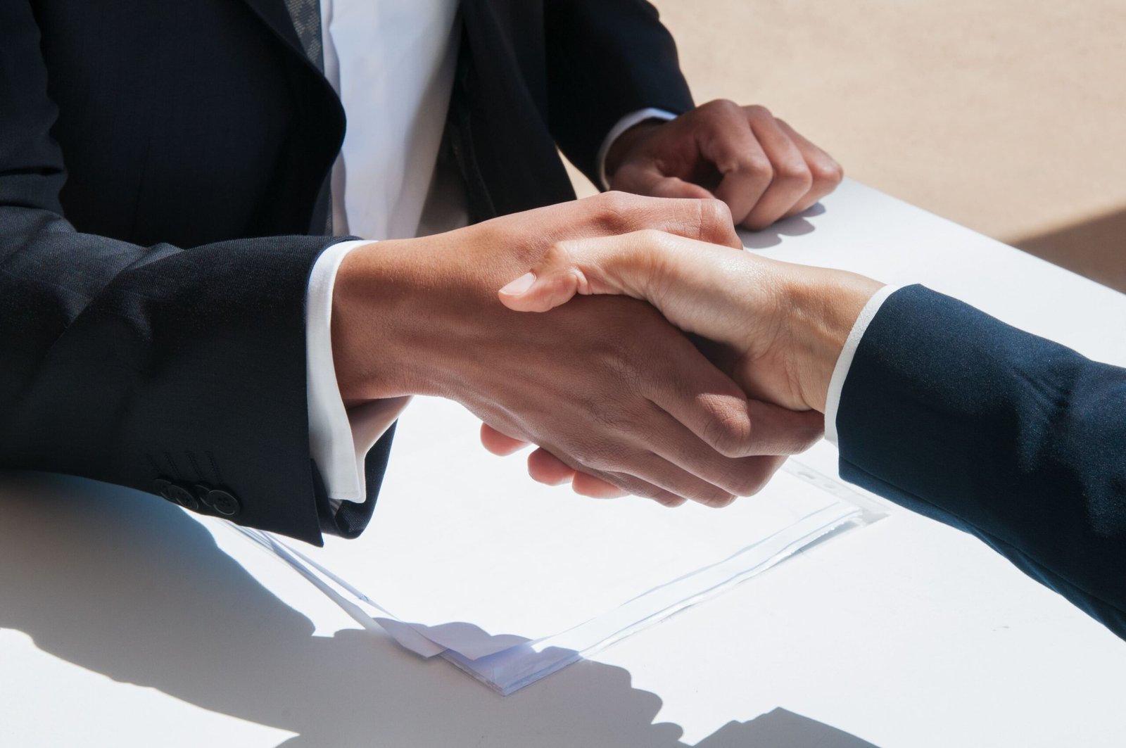 closeup business people shaking hands